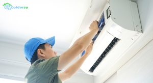 Repair-person-conducting-maintenance-on-an-air-conditioner-unit